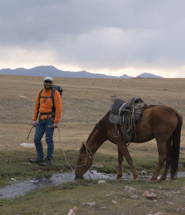 Tourist with horse near Song Kul lac
